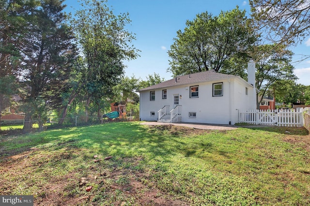 3803 Kayson St, Silver Spring, MD 20906 - rear view of house with a chimney, a fenced backyard, a patio area, and stucco siding