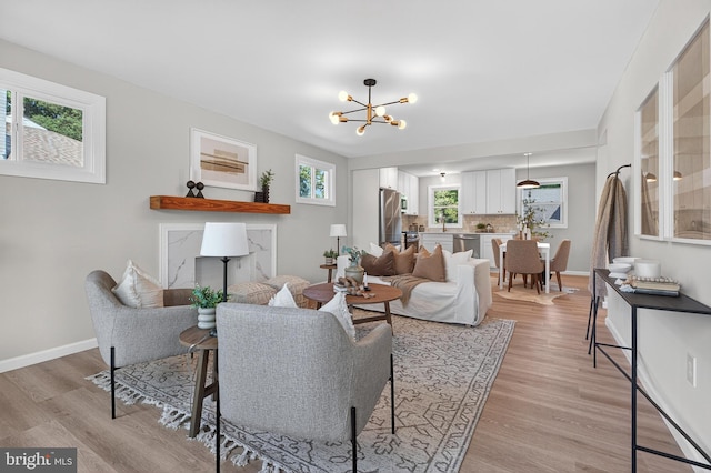 3803 Kayson St, Silver Spring, MD 20906 - living room with a chandelier and light wood finished floors