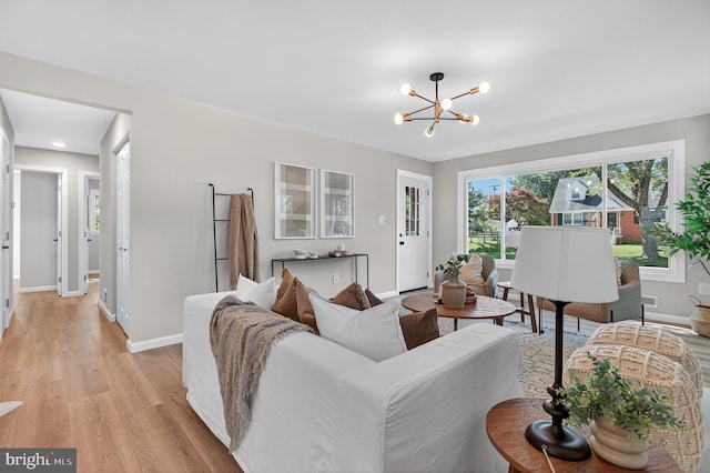 3803 Kayson St, Silver Spring, MD 20906 - living room with light wood-type flooring and a chandelier