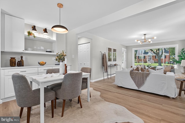 3803 Kayson St, Silver Spring, MD 20906 - dining area featuring a chandelier and light wood-type flooring