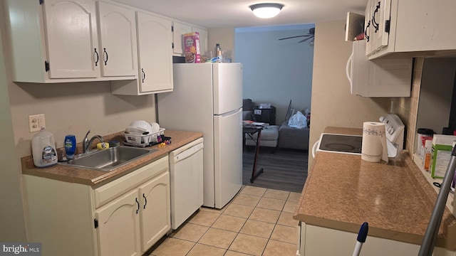2622 Cranberry Cir, Harrisburg, PA 17110 - kitchen featuring white appliances, light tile patterned floors, white cabinetry, and a ceiling fan