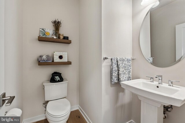 324 Star Tavern Ln, West Chester, PA 19382 - half bathroom with toilet and wood finished floors