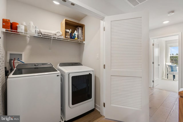 324 Star Tavern Ln, West Chester, PA 19382 - laundry area featuring independent washer and dryer, light wood finished floors, and recessed lighting