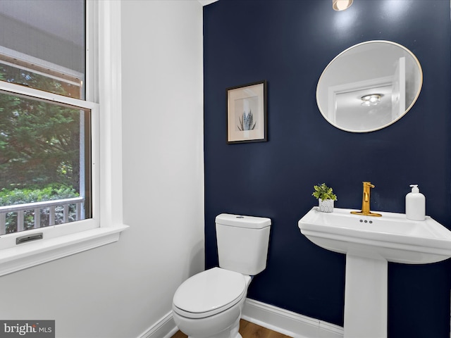 9300 Bellbeck Rd, Baltimore, MD 21234 - bathroom with baseboards and toilet