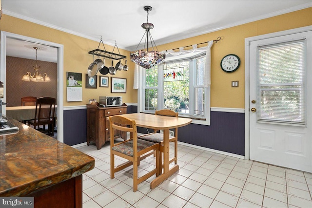 9210 Cherrytree Dr, Alexandria, VA 22309 - dining area with a chandelier, wainscoting, and ornamental molding