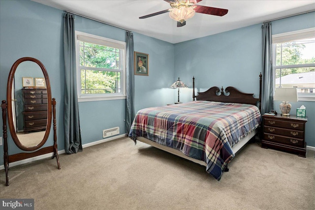 9210 Cherrytree Dr, Alexandria, VA 22309 - bedroom with multiple windows, carpet floors, and ceiling fan