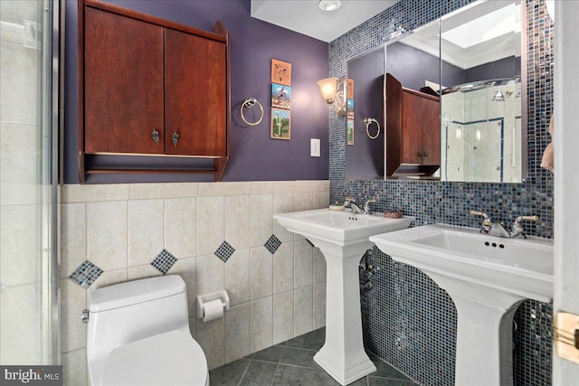 9210 Cherrytree Dr, Alexandria, VA 22309 - full bath featuring tile walls, a stall shower, and tile patterned floors