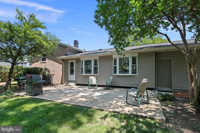 9210 Cherrytree Dr, Alexandria, VA 22309 - rear view of house featuring a patio and a chimney