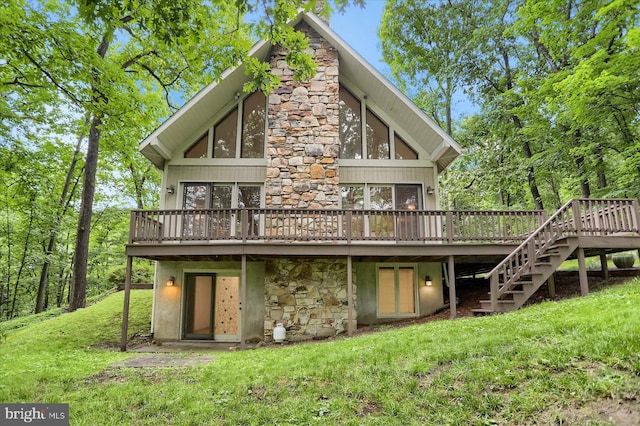 16 March Cir, Winfield, PA 17889 - rear view of property featuring a deck, a lawn, stairway, and stone siding
