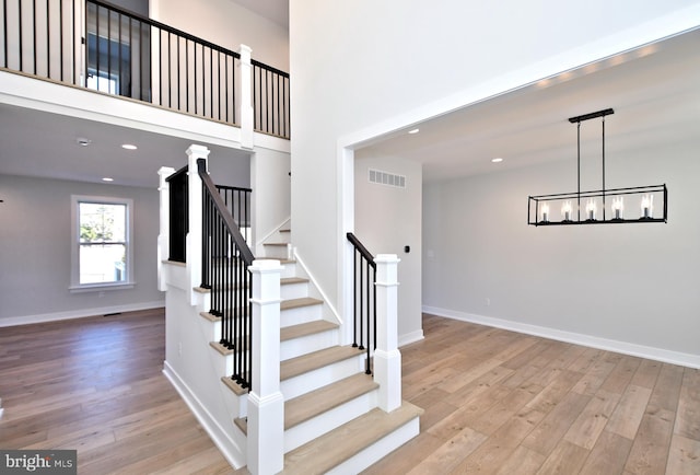 000 Lenape Dr, Lansdale, PA 19446 - staircase with wood finished floors, a chandelier, and recessed lighting