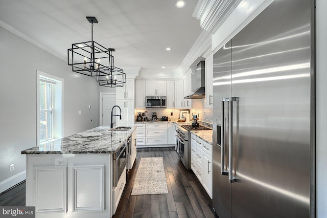 635 E Fort Ave, Baltimore, MD 21230 - kitchen featuring high quality appliances, ornamental molding, white cabinets, a chandelier, and dark wood-style flooring