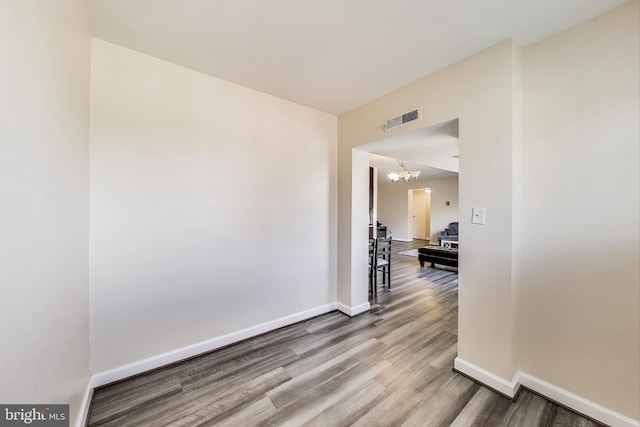 5851 Quantrell Ave Unit 407, Alexandria, VA 22312 - empty room with wood finished floors and a chandelier