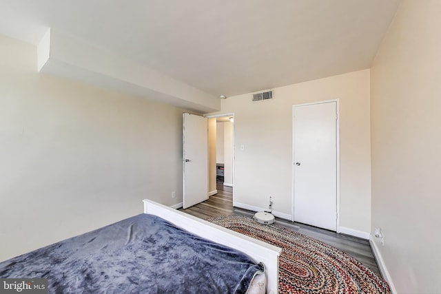 5851 Quantrell Ave Unit 407, Alexandria, VA 22312 - unfurnished bedroom featuring wood finished floors and baseboards