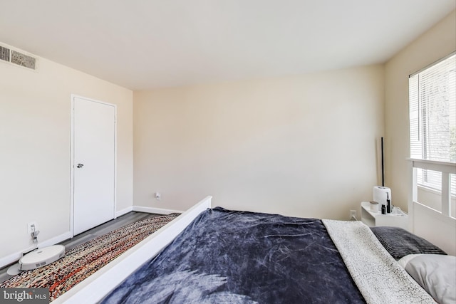 5851 Quantrell Ave Unit 407, Alexandria, VA 22312 - bedroom with wood finished floors and baseboards