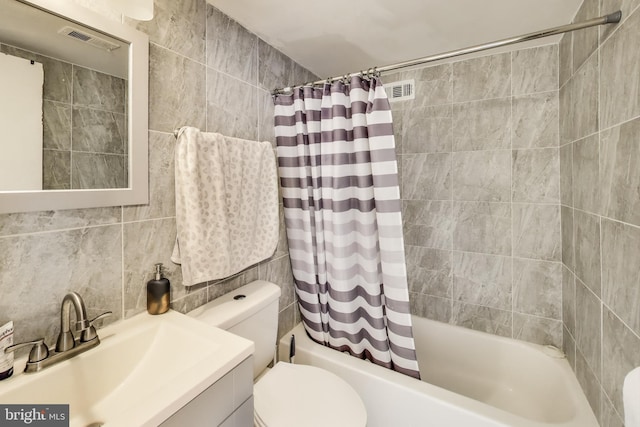 5851 Quantrell Ave Unit 407, Alexandria, VA 22312 - full bath featuring shower / bath combo with shower curtain, vanity, and tile walls
