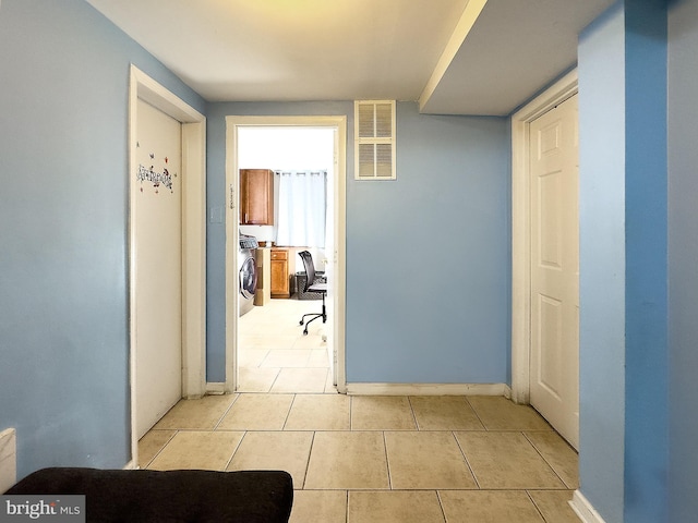 6802 Temple Hill Rd, Temple Hills, MD 20748 - hall with light tile patterned flooring and washer / dryer