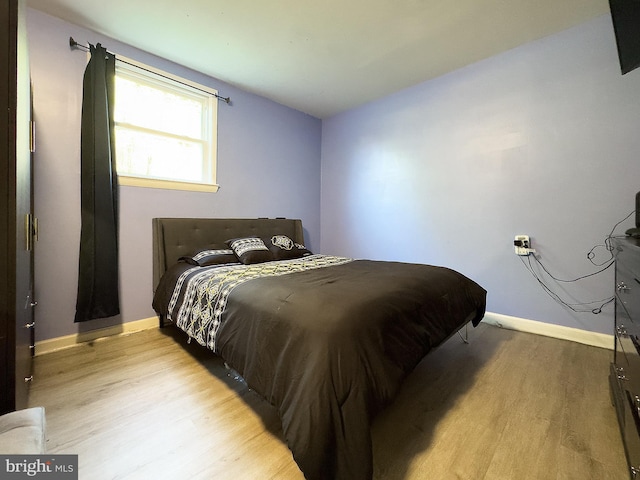 6802 Temple Hill Rd, Temple Hills, MD 20748 - bedroom featuring light wood-style flooring and baseboards