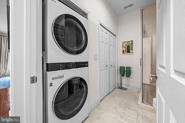 605 N Atlantic Ave Unit 104, Collingswood, NJ 08108 - laundry area featuring estacked washer and dryer and light tile patterned floors