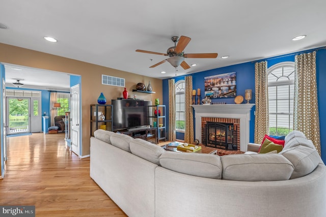 236 Cambridge Pl, Chalfont, PA 18914 - living room with light wood-style floors, a ceiling fan, a brick fireplace, and recessed lighting