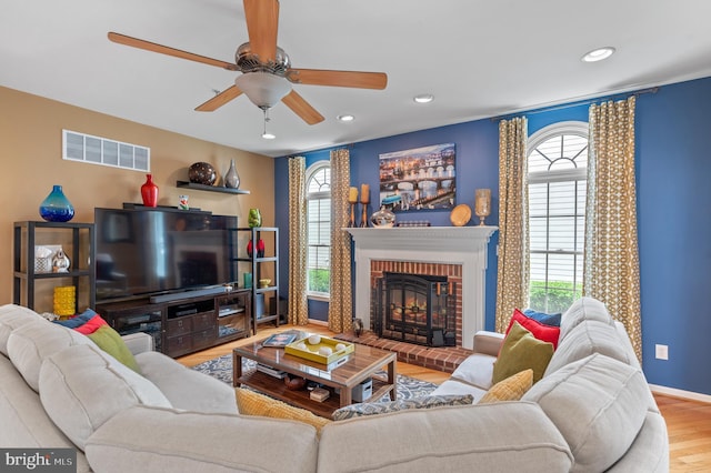 236 Cambridge Pl, Chalfont, PA 18914 - living area featuring wood finished floors, ceiling fan, a brick fireplace, and recessed lighting