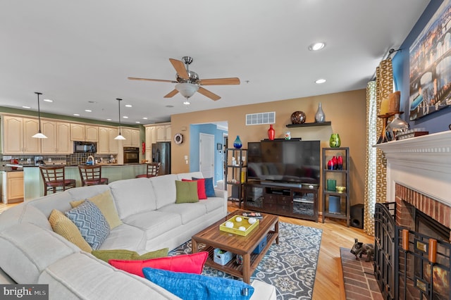 236 Cambridge Pl, Chalfont, PA 18914 - living area with a ceiling fan, light wood-style flooring, recessed lighting, and a fireplace