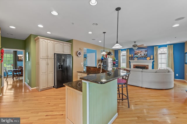 236 Cambridge Pl, Chalfont, PA 18914 - kitchen with black fridge, a breakfast bar, a ceiling fan, light wood-type flooring, and recessed lighting