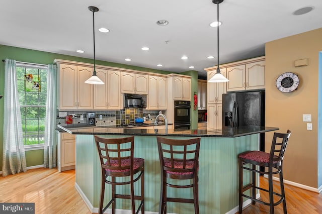 236 Cambridge Pl, Chalfont, PA 18914 - kitchen featuring black appliances, tasteful backsplash, light wood-type flooring, a kitchen island with sink, and recessed lighting