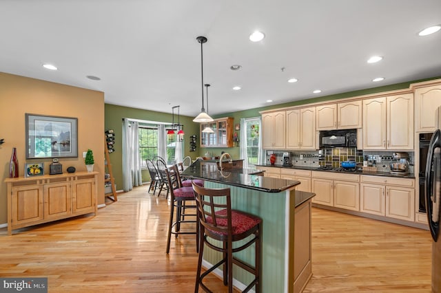236 Cambridge Pl, Chalfont, PA 18914 - kitchen featuring black microwave, a kitchen bar, light wood-type flooring, recessed lighting, and gas cooktop