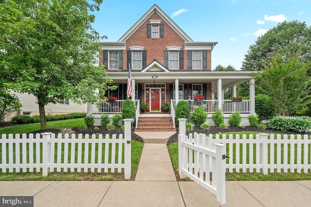 236 Cambridge Pl, Chalfont, PA 18914 - view of front of property with a porch, brick siding, and a fenced front yard