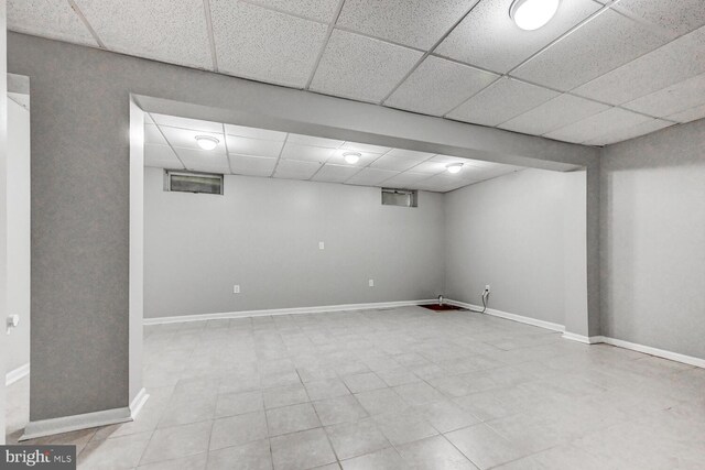 8125 Greenspring Vly, Owings Mills, MD 21117 - finished basement featuring a paneled ceiling and tile patterned floors