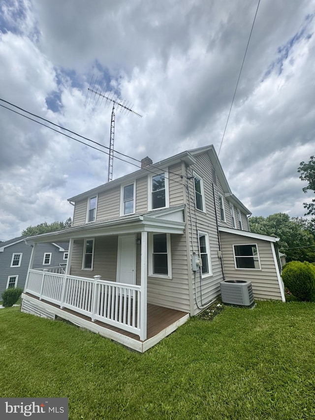 6054 Baltimore Pike, Littlestown, PA 17340 - view of front of home with a front lawn, covered porch, and a chimney