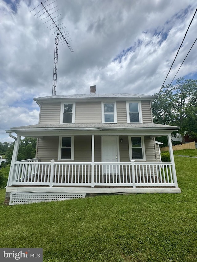 6054 Baltimore Pike, Littlestown, PA 17340 - country-style home featuring covered porch, a front yard, and a chimney