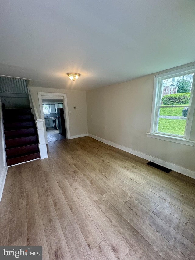 6054 Baltimore Pike, Littlestown, PA 17340 - empty room featuring stairs and light wood-style floors