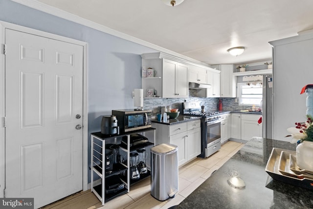 330 N 13th St, Reading, PA 19604 - kitchen featuring stainless steel appliances, under cabinet range hood, open shelves, tasteful backsplash, and light tile patterned flooring
