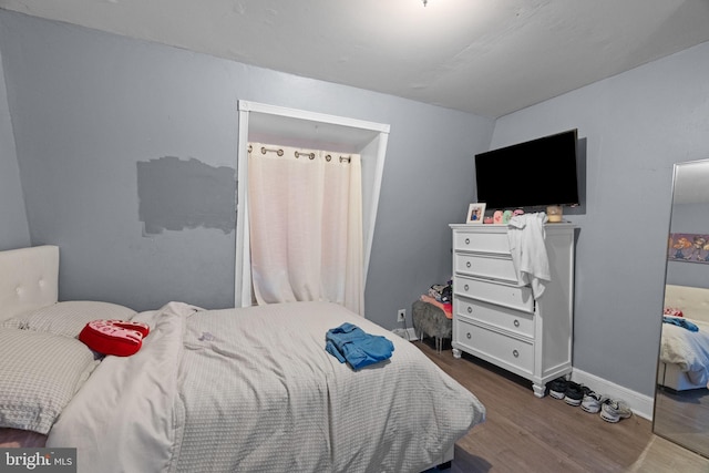 330 N 13th St, Reading, PA 19604 - bedroom featuring wood finished floors and baseboards