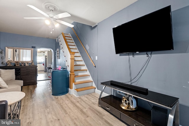 330 N 13th St, Reading, PA 19604 - living area featuring arched walkways, a ceiling fan, wood finished floors, and stairway