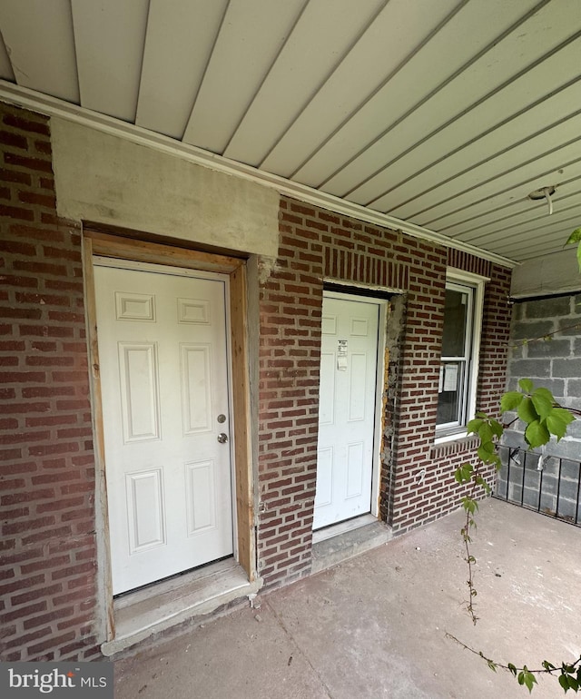 706 Edgemore Rd, Philadelphia, PA 19151 - doorway to property with brick siding