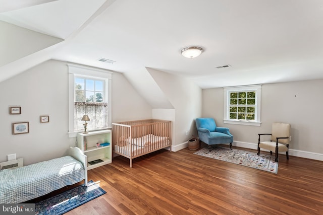 720 E Stephens Ln, Purcellville, VA 20132 - bedroom with wood finished floors, multiple windows, and vaulted ceiling