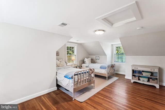 720 E Stephens Ln, Purcellville, VA 20132 - bedroom with attic access, wood finished floors, multiple windows, and vaulted ceiling