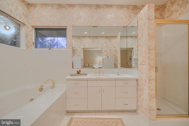 7900 Ivy Ln, Baltimore, MD 21208 - bathroom with vanity, a whirlpool tub, a stall shower, tile patterned flooring, and wallpapered walls
