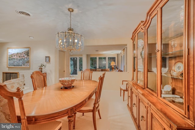 7900 Ivy Ln, Baltimore, MD 21208 - dining area with a chandelier, healthy amount of natural light, and light colored carpet