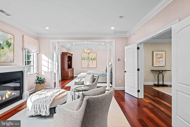3537 Sawmill Rd, Newtown Square, PA 19073 - living area featuring dark wood-type flooring, a chandelier, a glass covered fireplace, ornamental molding, and recessed lighting
