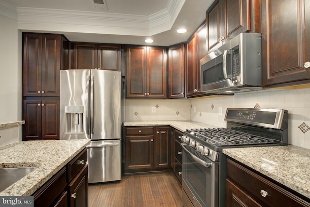 13764 Earhart Cir, Herndon, VA 20171 - kitchen featuring stainless steel appliances, ornamental molding, decorative backsplash, recessed lighting, and light stone countertops