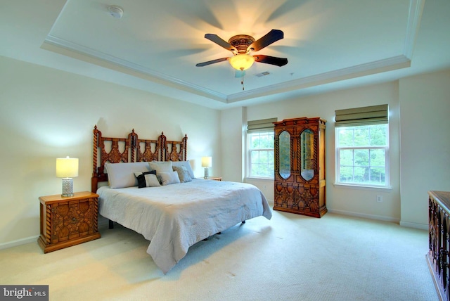 13764 Earhart Cir, Herndon, VA 20171 - carpeted bedroom featuring a tray ceiling, multiple windows, ornamental molding, and a ceiling fan