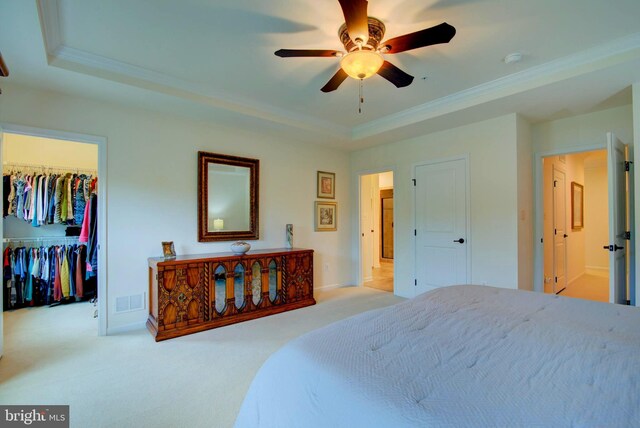 13764 Earhart Cir, Herndon, VA 20171 - bedroom with ornamental molding, a tray ceiling, carpet flooring, a spacious closet, and a closet