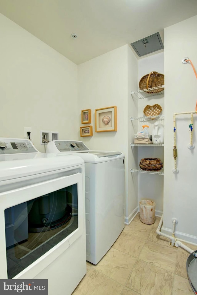 13764 Earhart Cir, Herndon, VA 20171 - laundry room with separate washer and dryer and baseboards