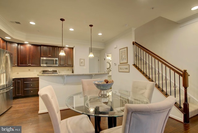 13764 Earhart Cir, Herndon, VA 20171 - dining area featuring ornamental molding, dark wood-style flooring, stairway, and recessed lighting