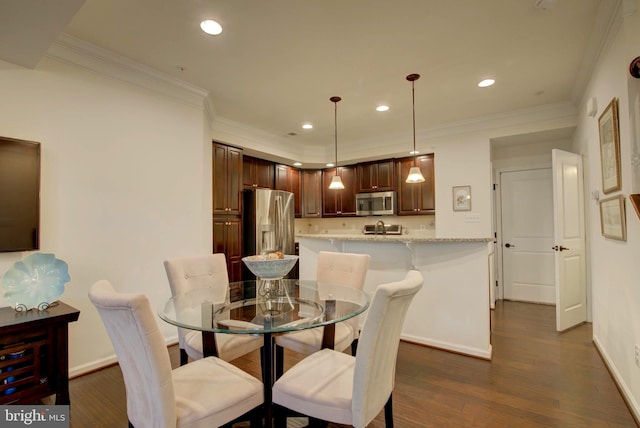 13764 Earhart Cir, Herndon, VA 20171 - dining space featuring dark wood finished floors, crown molding, and recessed lighting