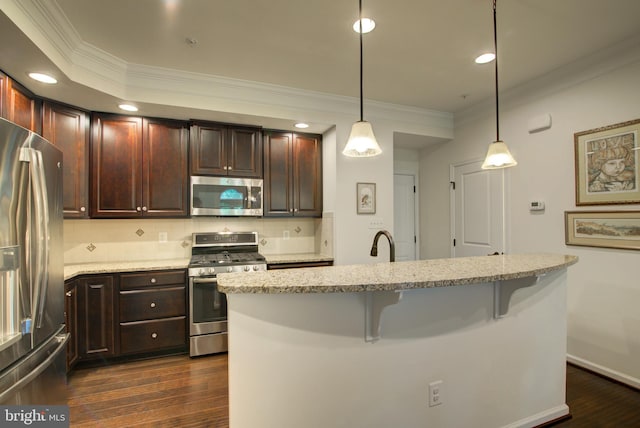 13764 Earhart Cir, Herndon, VA 20171 - kitchen featuring stainless steel appliances, crown molding, a kitchen bar, dark wood finished floors, and backsplash