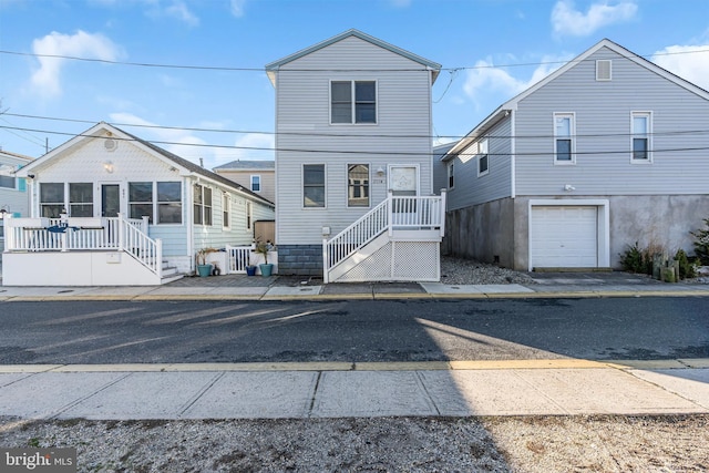 235 Bay Ter, Seaside Heights, NJ 08751 - view of front of property with a sunroom and an attached garage